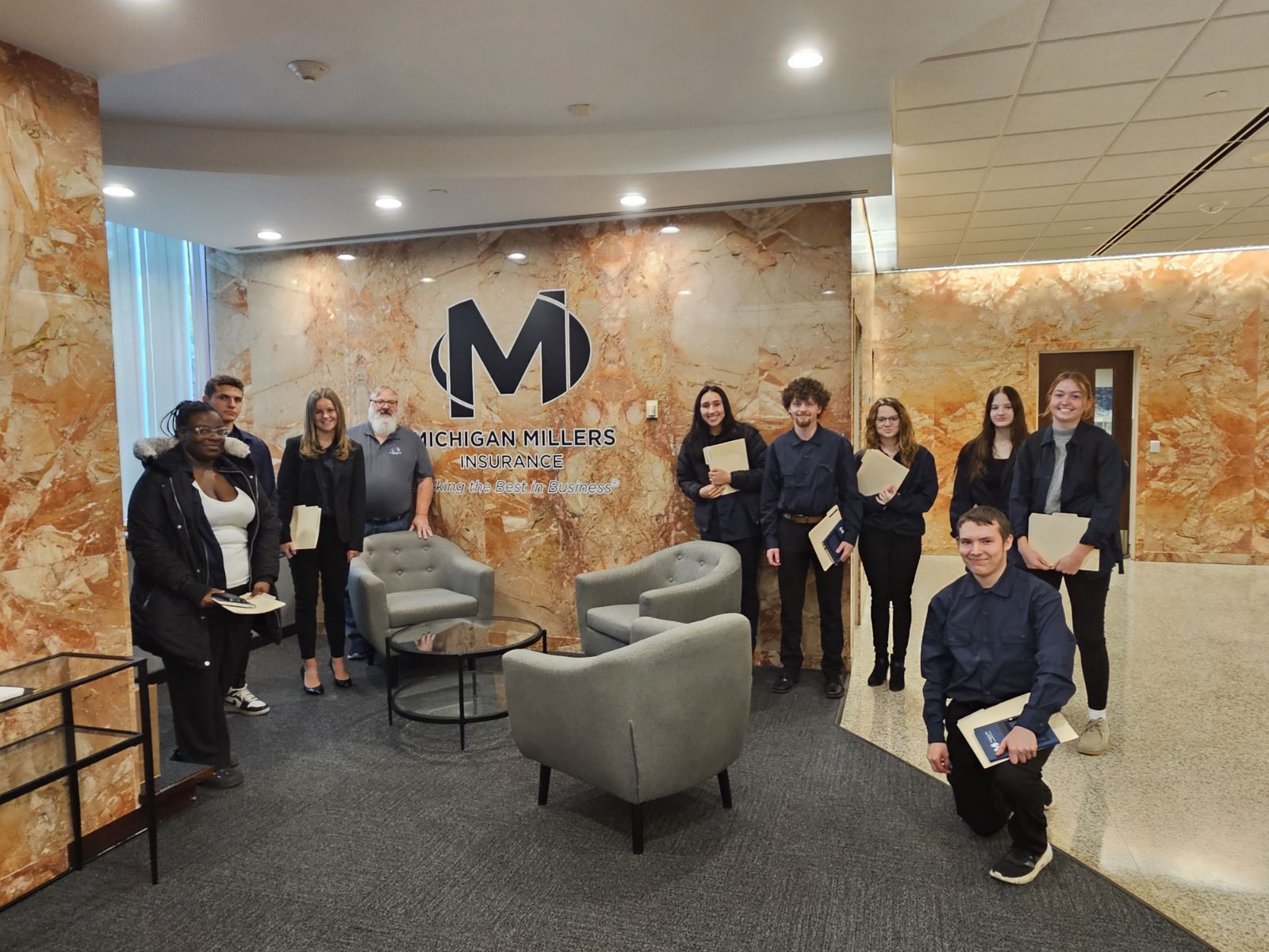 Group of Trainees photographed with Michigan Millers employee.